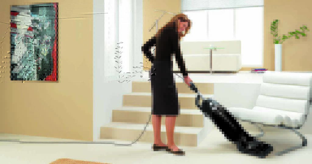 Woman vacuuming with Miele Dynamic U1 Maverick